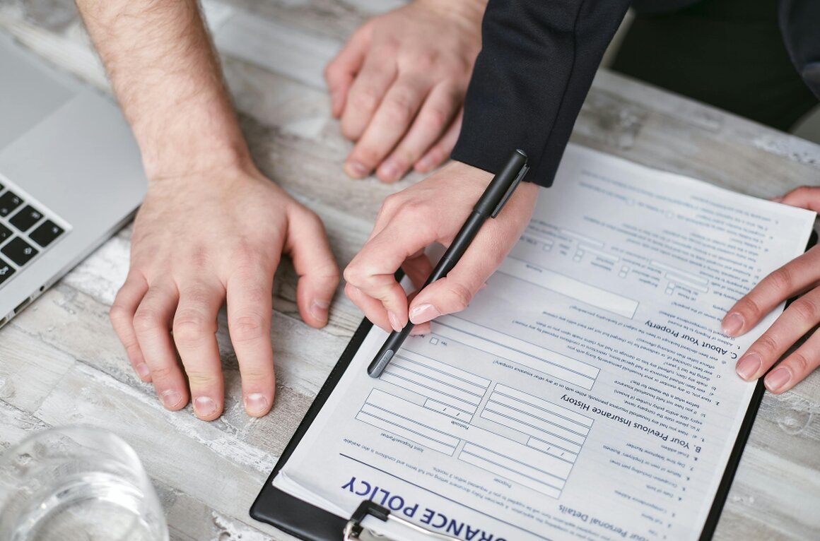 Share purchase agreement and legal documents on a desk